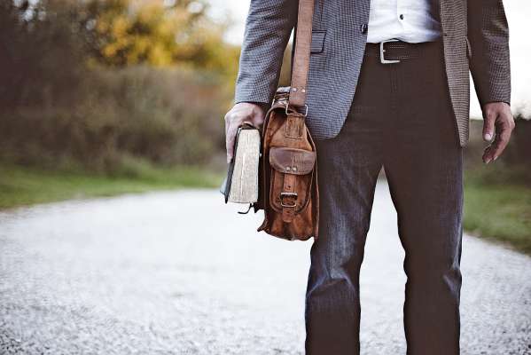 media/k2/galleries/19895/thumbs/closeup-shot-male-wearing-business-suit-standing-while-holding-bible_web.jpg
