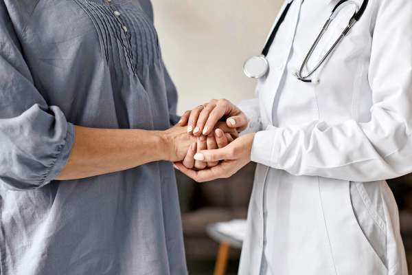 media/k2/galleries/25489/thumbs/covid-recovery-center-female-doctor-holding-older-patient-s-hands_web.jpg
