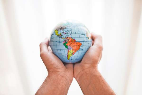 media/k2/galleries/25555/thumbs/person-s-hand-holding-small-globe_web.jpg